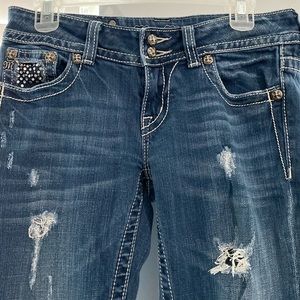 “Destroyed” Miss Me jeans